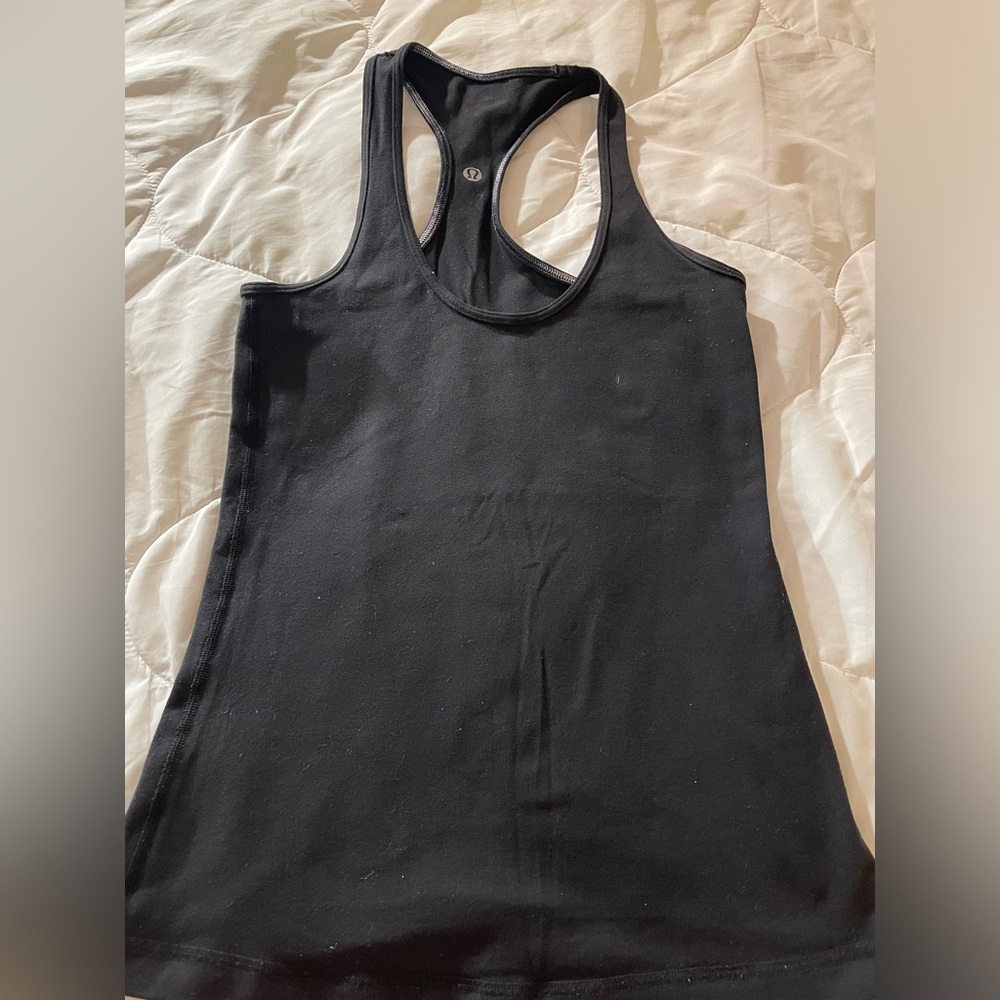 Lululemon Athelitica. Black spandex shirt. Razorback. Size M. Great Condition.